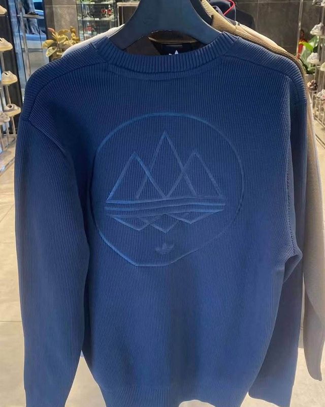 Back of the leaked adidas Spezial AW26 navy knit with large embossed mountain badge