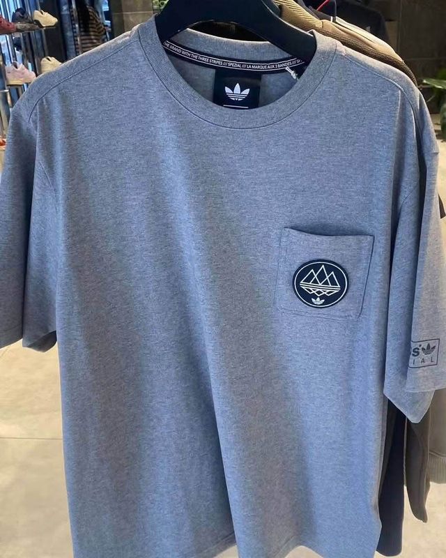 Leaked adidas Spezial AW26 grey marl pocket T-shirt with mountain-badge patch