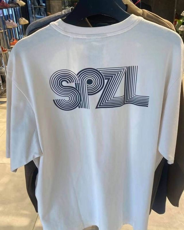 Back of the leaked adidas Spezial AW26 white T-shirt with large striped SPZL print